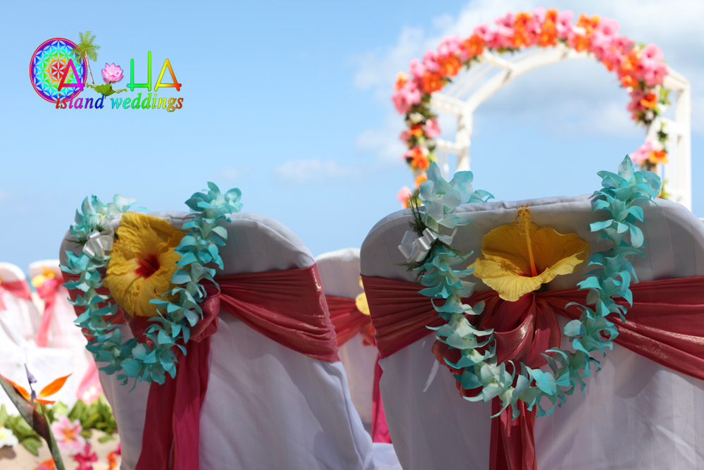 beach wedding with turquoise orchids and yellow hibiscus flower